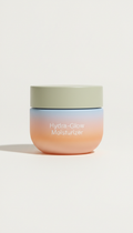 Hydra-Glow Moisturizer, Default angle is three-quarter front at low eye level to hero the packaging silhouette and...